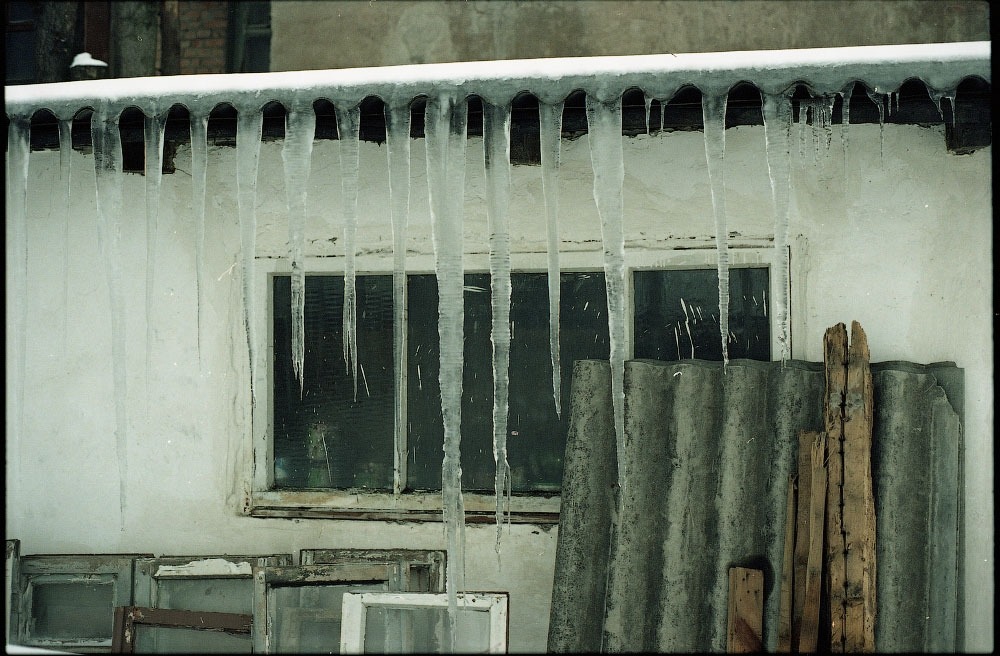 A photo of Kharkiv. It looks cold, and the buildings are mostly made of bare metal.